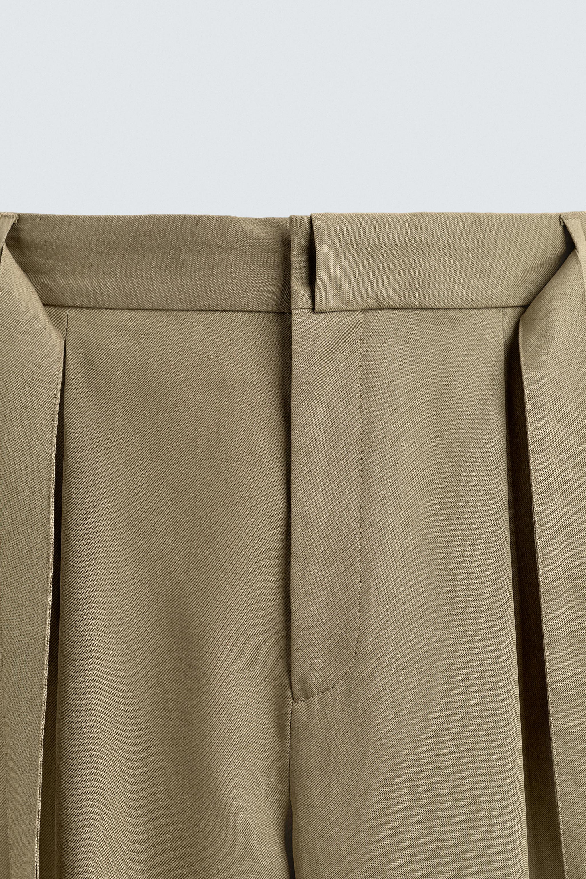 FLOWY PLEATED BELTED PANTS